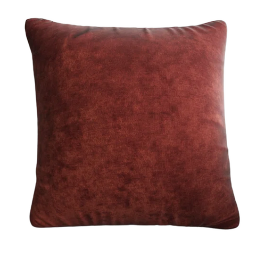 Rust crushed velvet throw pillow, 16x16 square design with soft texture and reversible fabric, styled on a modern sofa for cozy and elegant home decor.

