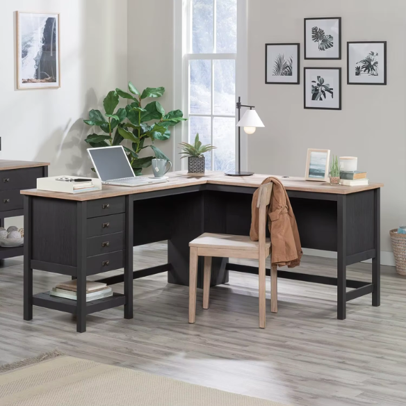 Rustic black L-shaped executive desk with split oak tabletop and storage drawers for home office or study.
