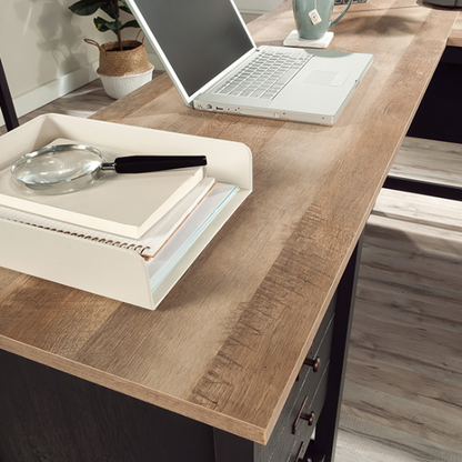 Rustic black L-shaped executive desk with split oak tabletop and storage drawers for home office or study.