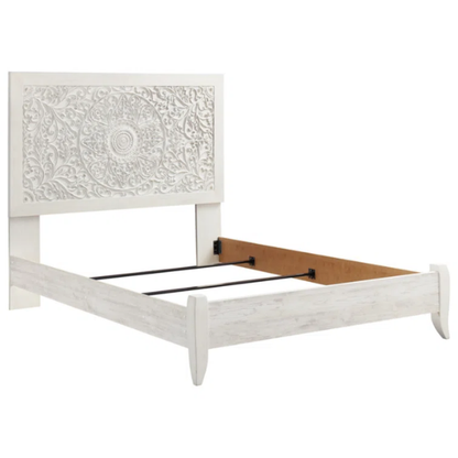 Rustic white king panel bed with intricately carved medallion headboard, decorative laminate finish, and adjustable height frame

