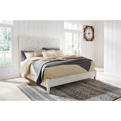 Rustic white king panel bed with intricately carved medallion headboard, decorative laminate finish, and adjustable height frame

