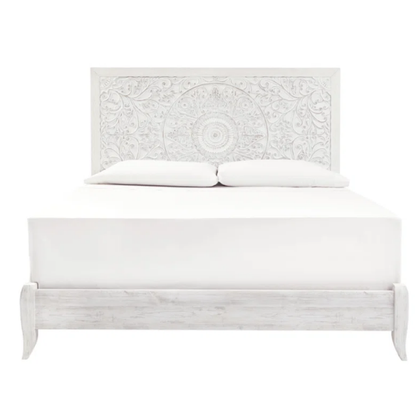 Rustic white king panel bed with intricately carved medallion headboard, decorative laminate finish, and adjustable height frame

