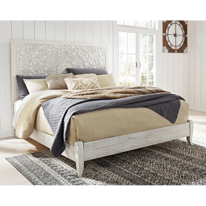 Rustic white king panel bed with intricately carved medallion headboard, decorative laminate finish, and adjustable height frame

