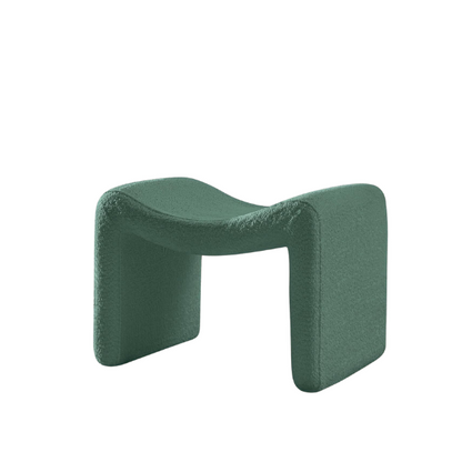 Green bouclé pedal stool with modern semicircular design, engineered wood frame, and soft sherpa fabric, ideal as a footrest or extra seating, perfect for any room.