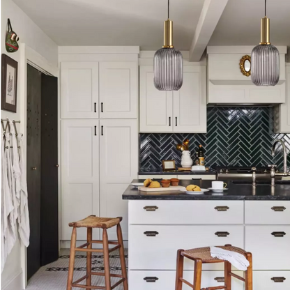 Modern grey glass pendant light with gold finish, ideal for contemporary and industrial interiors.