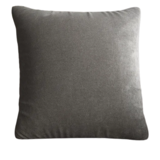Silver crushed velvet throw pillow, 16x16 square with soft, reversible fabric and hidden zipper, styled on a modern sofa for a sleek, elegant look.

