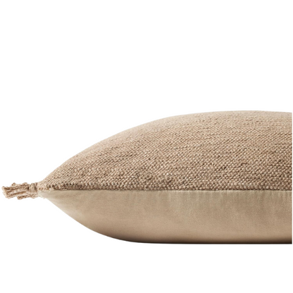 Tan cotton blend throw pillow with fringe, 22x22 square cushion featuring soft texture and hidden zipper, styled on a neutral sofa for cozy, earthy decor.

