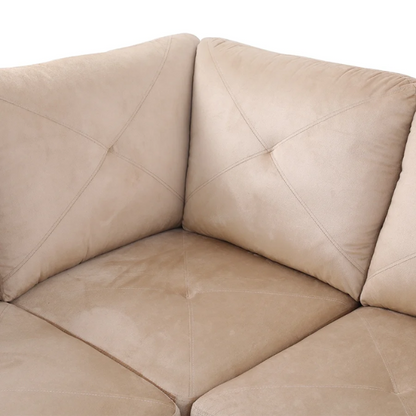 Tan L-shaped sectional sofa with right-facing chaise and ottoman, microfiber upholstery and light gray wooden legs