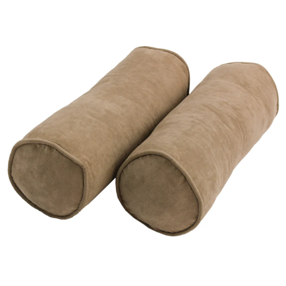 Set of 2 tan bolster throw pillows with soft microsuede covers, corded edges, and plush polyester fill, perfect for adding warmth and comfort to any indoor space.


