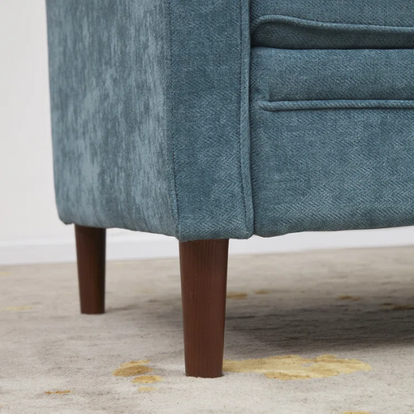 Teal chenille upholstered sofa with curved track arms, soft foam cushions, and tapered wooden legs in a mid-century modern style.