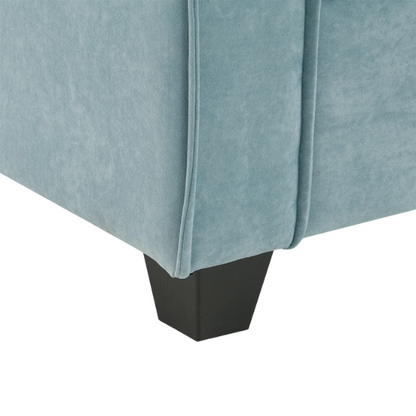Tranquil sea blue suede L-shaped sectional sofa with tufted seat cushions, reversible chaise, removable ottoman, and two matching throw pillows