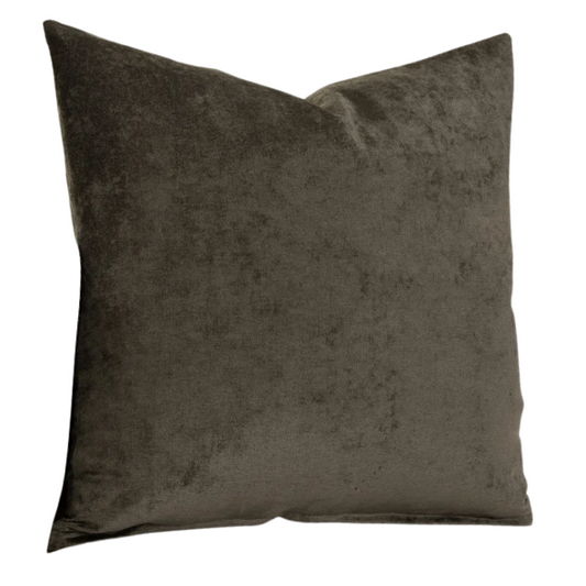 Umber crushed velvet throw pillow, 16x16 square with soft, reversible fabric and hidden zipper, styled on a cozy sofa for a warm, elegant touch.


