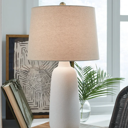 Set of two white ceramic table lamps with textured conical bases and modified drum fabric shades, 3-way switch, 26.5 inches tall.

