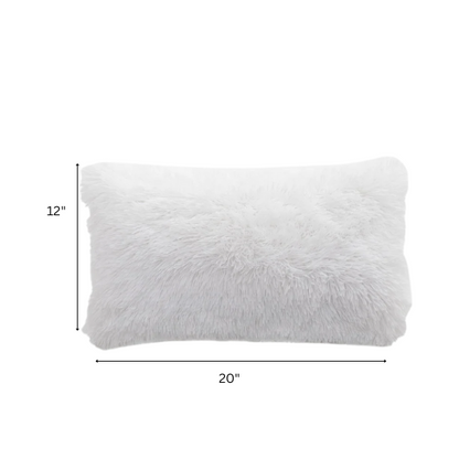 Set of two white faux fur throw pillows with fluffy texture on a modern neutral-toned couch

