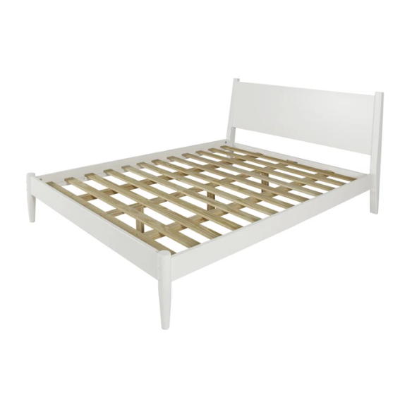 White full-size mid-century modern solid wood platform bed with tapered legs and rectangular headboard