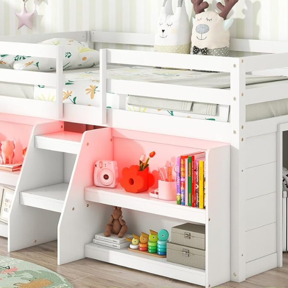 White twin low loft bed with LED lights, built-in bookshelf, under-bed storage, and stair access – ideal for kids or small bedrooms.