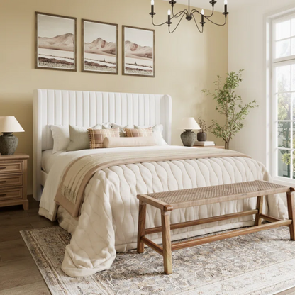 White full-size velvet upholstered platform bed with tufted wingback headboard and wood slats