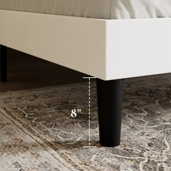 White full-size velvet upholstered platform bed with tufted wingback headboard and wood slats