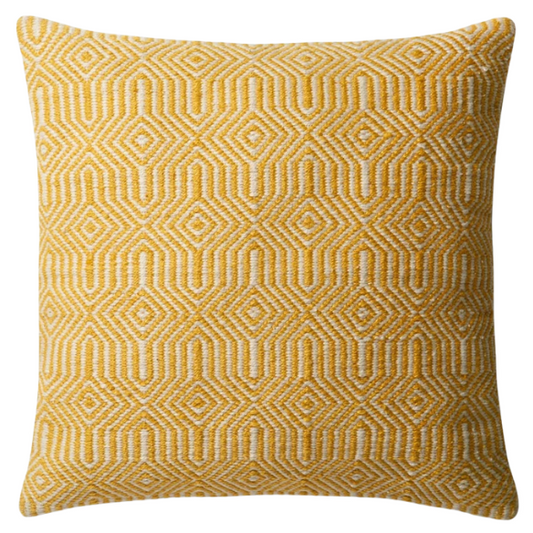 Yellow and cream geometric throw pillow on a bright outdoor chair with summer decor

