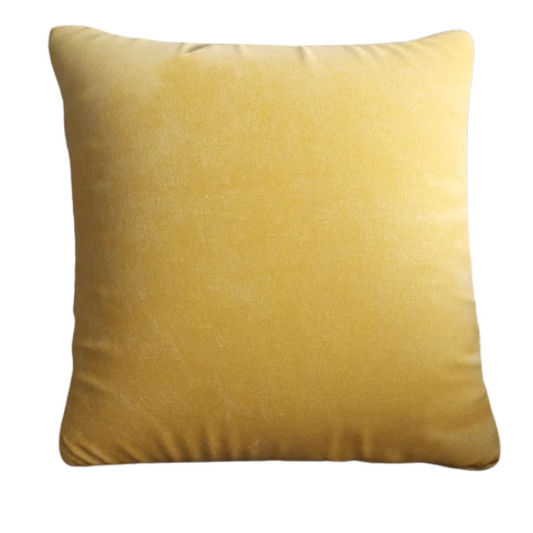Yellow crushed velvet throw pillow, 16x16 square design with soft, reversible fabric and hidden zipper, styled on a light-toned sofa for a cheerful, cozy look.

