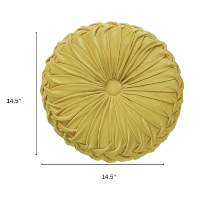 Yellow velvet round throw pillows with pleated detailing and button center, 14.5-inch set of two styled in a cozy, sunlit room.

