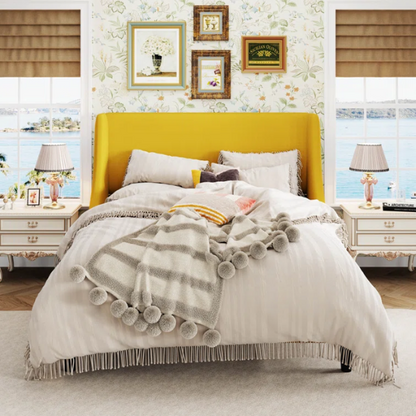 Yellow linen upholstered queen platform bed with wingback headboard, slatted base, and black tapered legs – no box spring required

